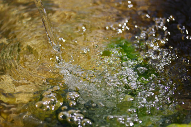istock Bubbles in the water. Water background. Fresh drinking water. 1292542623