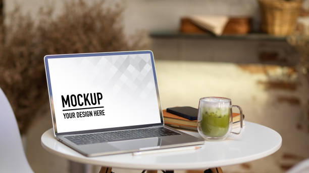 istock Portable workspace with laptop, supplies and matcha latte on coffee table 1292542901
