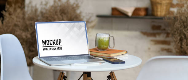 istock Portable workspace with laptop, smartphone, notebook and matcha latte 1292542932