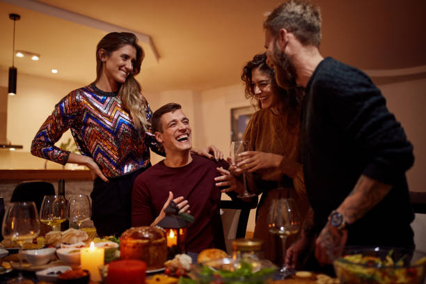 istock Friends Talking After Christmas Dinner At Home 1292545532