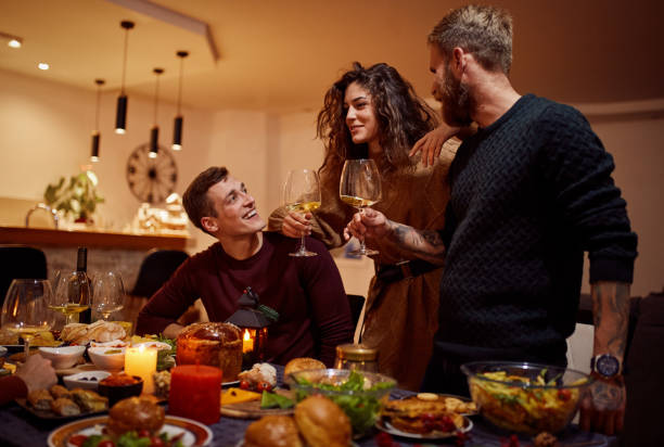 istock Friends Talking After Christmas Dinner At Home 1292545542