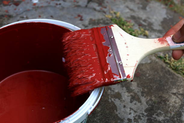 istock Fresh paint in brush at can with paint 1292545688