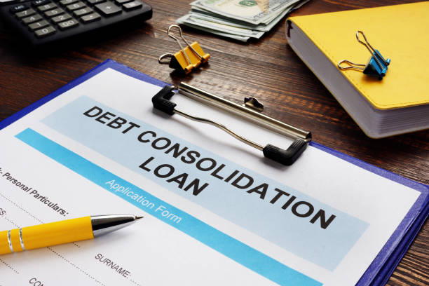 Debt consolidation loan, notepad and calculator. Debt consolidation loan form, notepad and calculator. business consolidation loan stock pictures, royalty-free photos & images