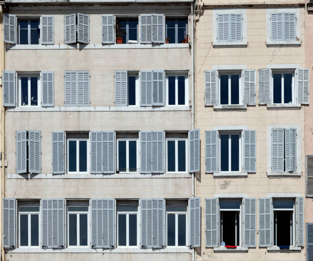 istock typical facade of an old hotel with open and closed shutters 1292549986