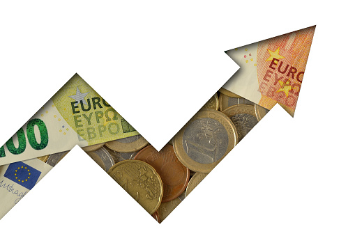 Upward arrow made of euro coins and banknotes on white background - Concept of growing and upward trend of euro currency