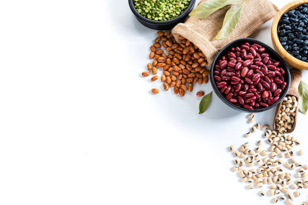 istock Beans variation shot from above on white background with copy space 1292553528