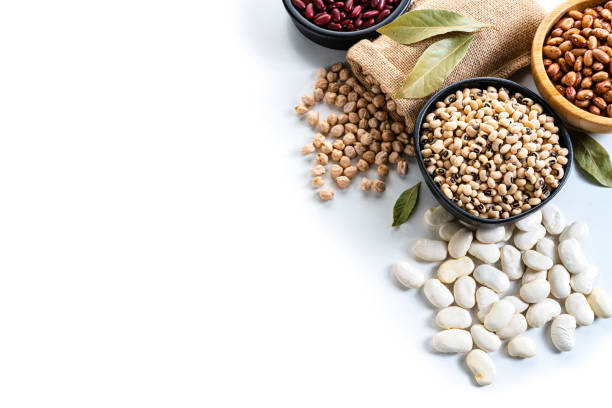 istock Beans variation shot from above on white background with copy space 1292553529