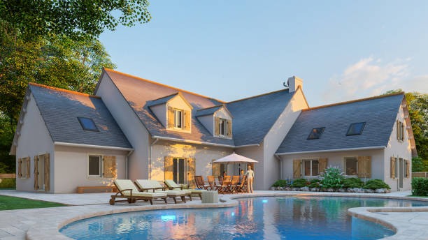 istock Classical pitched slate roof house with pool and garden 1292554886