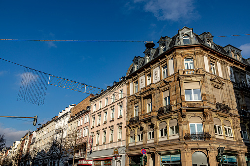 Wiesbaden, Germany - December 19, 2020: street sign Taunusstrasse - Taunus street and facade of historic houses in Wiesbaden during christmas time.