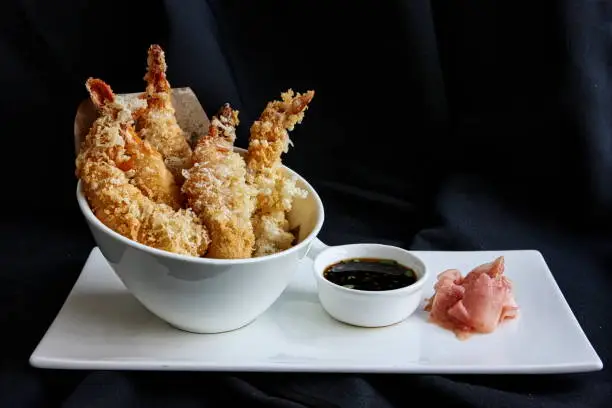 Tempura shrimps (deep fried shrimps) seved with soy sauce and jinger slice