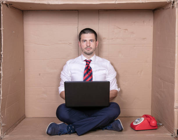 istock businessman with full concentration works on his laptop, a tight office is not a problem 1292555776