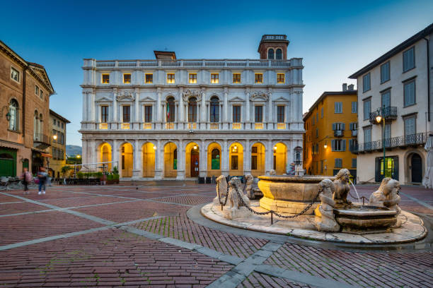 Beautiful architecture of the Piazza Vecchia in Bergamo at dawn stock photo