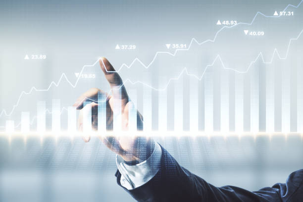 istock Multi exposure of analyst hand with pen working with virtual abstract financial diagram on blurred office background, banking and accounting concept 1292556154
