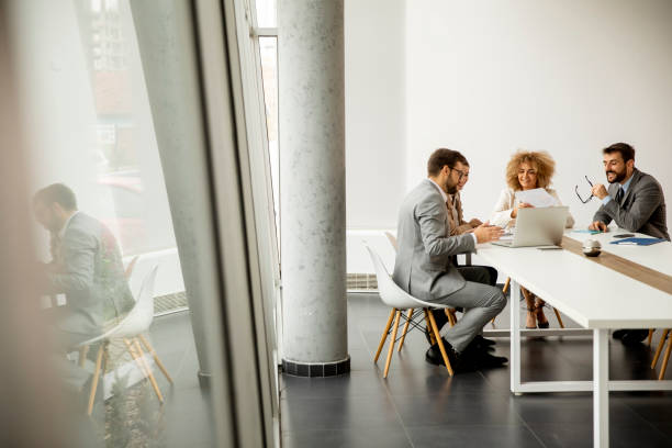 istock Multiethnic business people working together in the office 1292558400