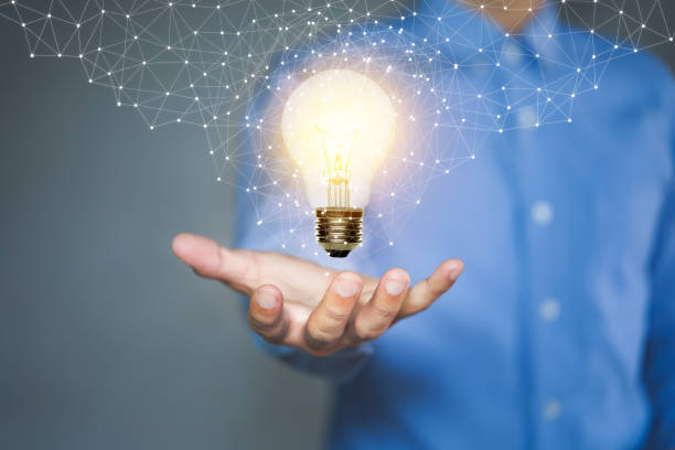 istock Light bulb, Innovative idea in the hand of businessman. 1292558771