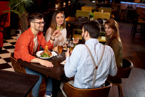 istock Young people having dinner in the restaurant 1292559608