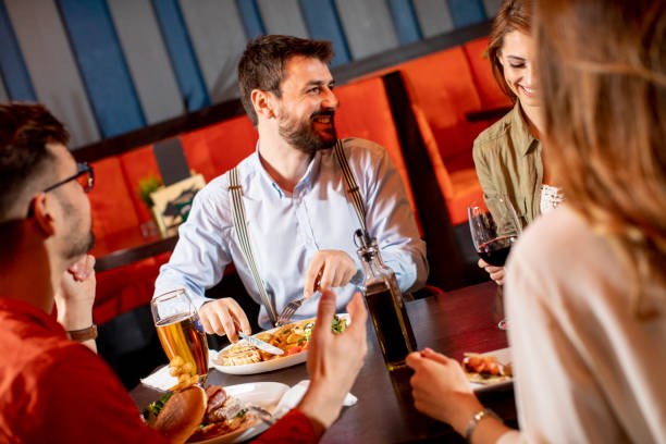 istock Young people having dinner in the restaurant 1292559609