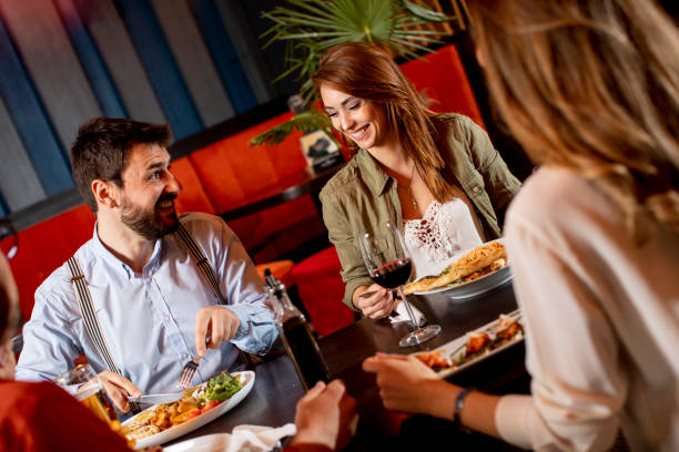 istock Young people having dinner in the restaurant 1292559614