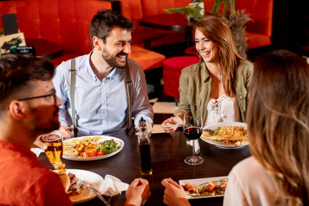istock Young people having dinner in the restaurant 1292559615