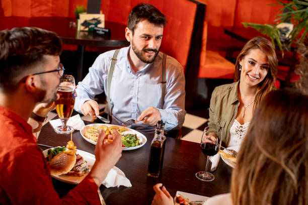 istock Young people having dinner in the restaurant 1292559617