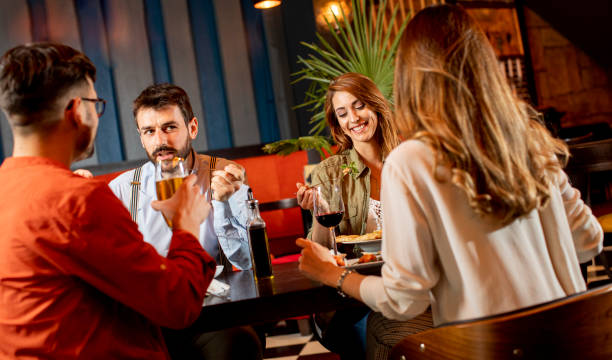 istock Young people having dinner in the restaurant 1292559618