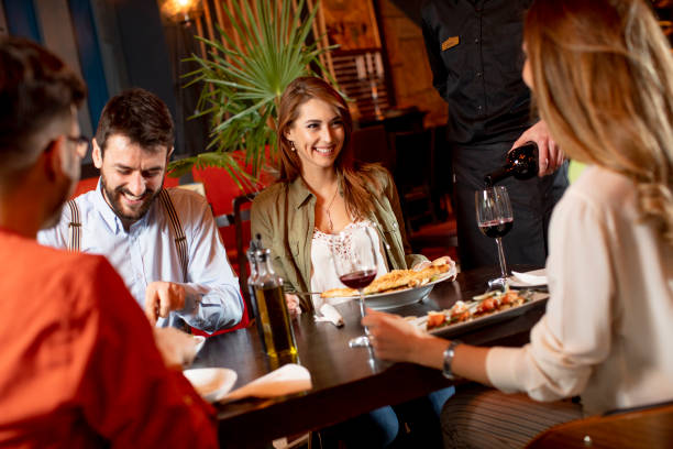 istock Young people having dinner in the restaurant 1292559633