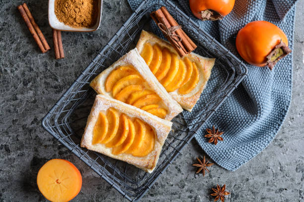 istock Persimmon puff pastry pies with cinnamon 1292560681