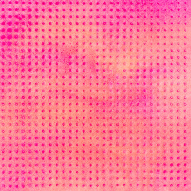 pink with black polka dots fabric background pattern.