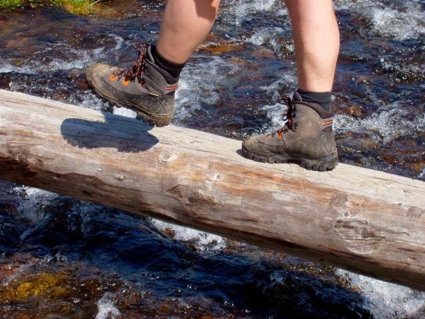 istock mountain stream and feet in the alps 1292562274