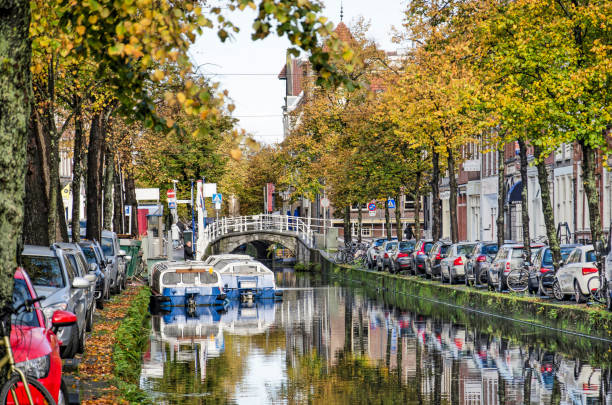 Alkmaar, The Netherlands - August 9, 2022: Cityscape of Alkmaar with bridge, canal and boats in the center of Alkmaar North Holland in The Netherlands