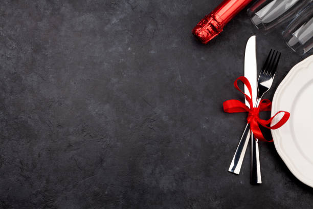 istock Valentines day with plate, champagne glasses and silverware 1292568439
