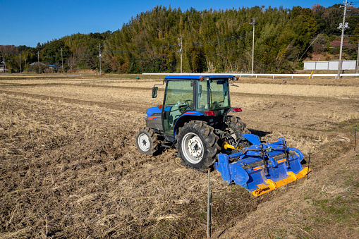 A tractor prepared for cultivating rice