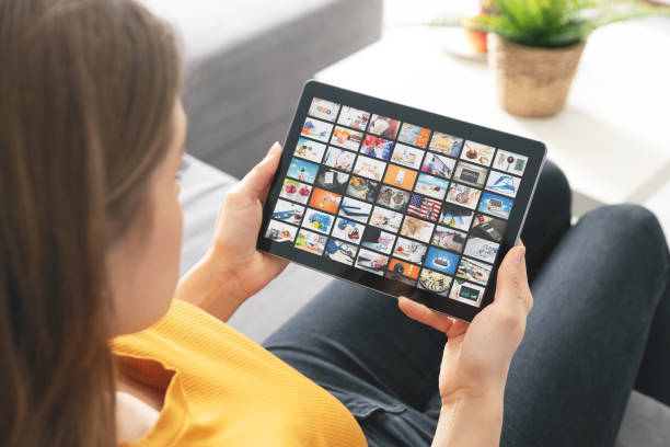 istock Woman watching TV on tablet. Multimedia services 1292569190