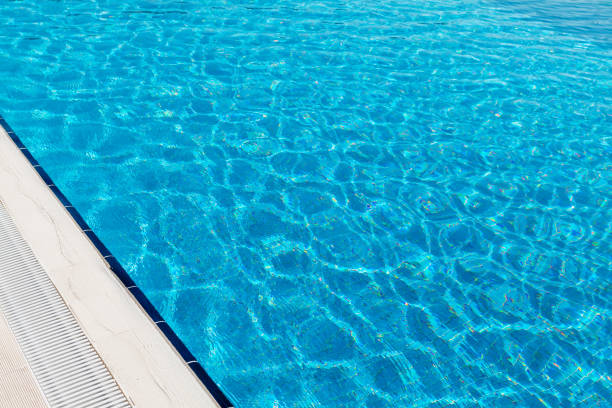 istock Sunny swimming pool in tropical resort 1292569216