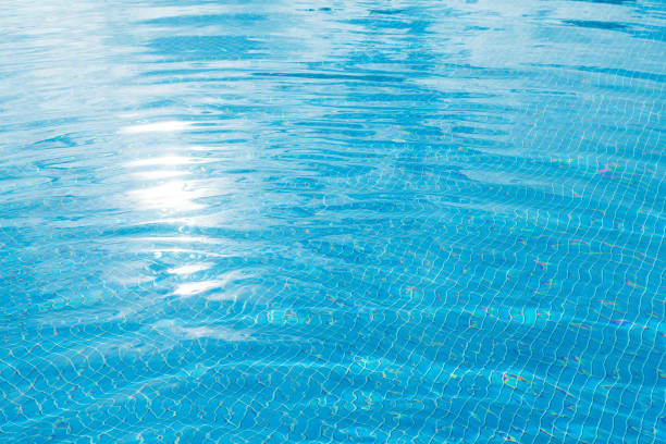 istock Sunny swimming pool in tropical resort 1292569237