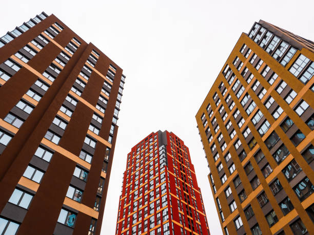 istock Modern architecture. Colored Skyscrapers. Multi-storey residential buildings. Vertical perspective up into the sky. Isolate. 1292570918