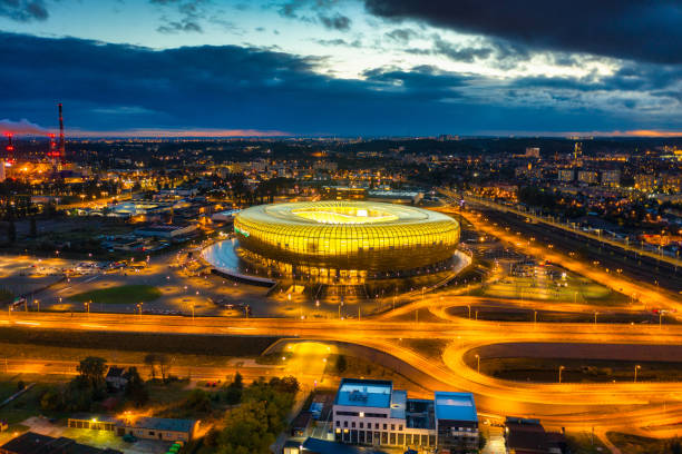 Aerial landscape with amber shape Energa Stadium in Gdansk at dusk, Poland. Gdansk, Poland - 19 October, 2020: Aerial landscape with amber shape Energa Stadium in Gdansk at dusk, Poland. gdansk city stock pictures, royalty-free photos & images