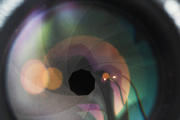 istock Camera lens in detail, open aperture with reflections 1292573906