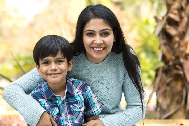 istock Happy Indian mother and son spending leisure time at park 1292573934