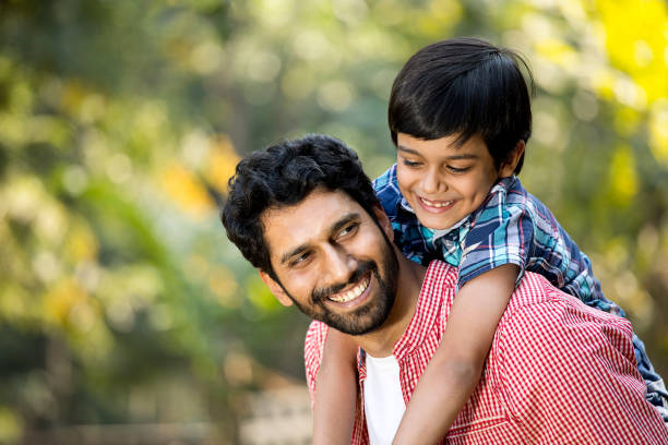 istock Loving father and son spending leisure time at park 1292573967