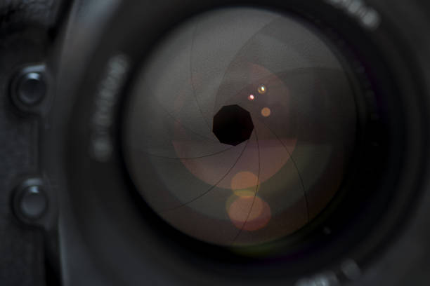 istock Camera lens in detail, open aperture with reflections 1292574006