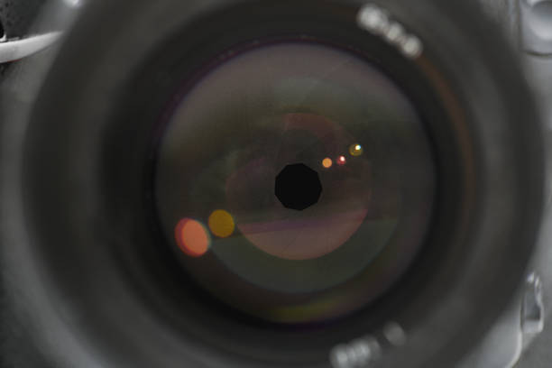 istock Camera lens in detail, open aperture with reflections 1292574318