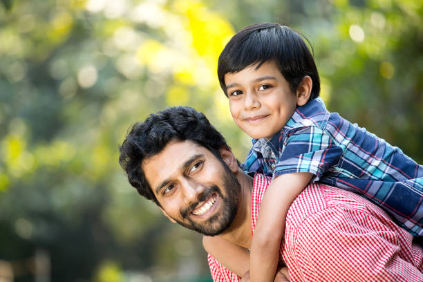 istock Loving father and son spending leisure time at park 1292575075