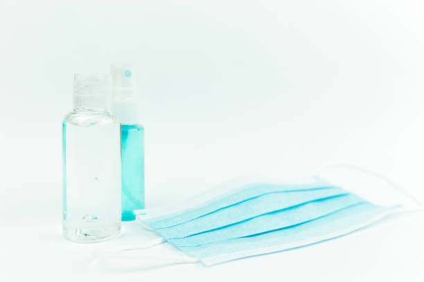 istock Sanitizer and blue mask on the table 1292575382