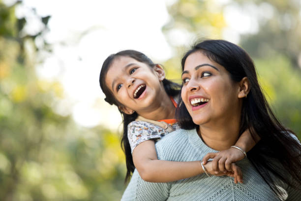 istock Mother and daughter having fun at the park 1292576116