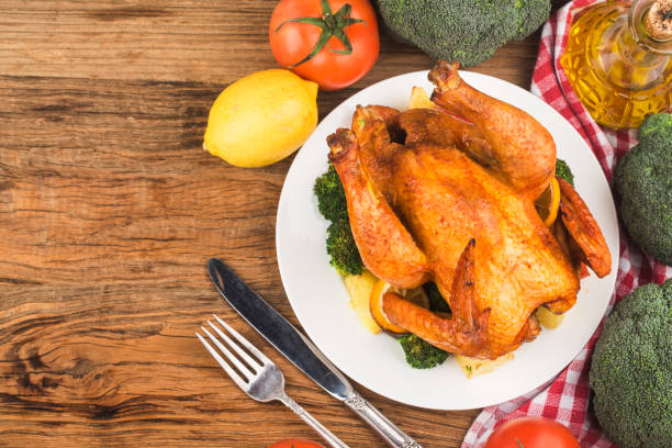 istock roasted chicken and vegetables on wooden table 1292578511