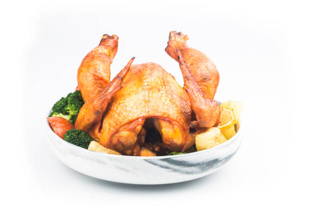 istock roasted chicken and vegetables on wooden table 1292580003