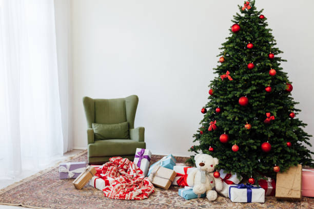 istock beautiful Christmas tree with gifts decor new year terrier 1292581935