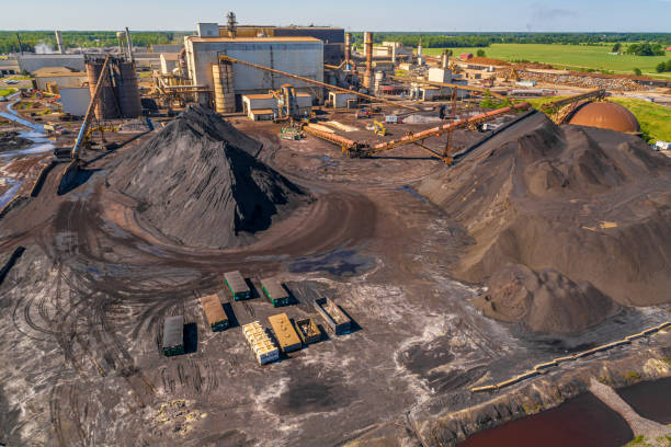 Aerial Overhead View of Mining Operations and Equipment and Metal Processing Facility. Aerial Overhead View of Mining Operations and Equipment. Cranes, Conveyors, ore and mineral. slag heap stock pictures, royalty-free photos & images