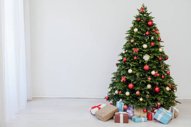 istock beautiful Christmas tree with gifts decor new year 1292582614